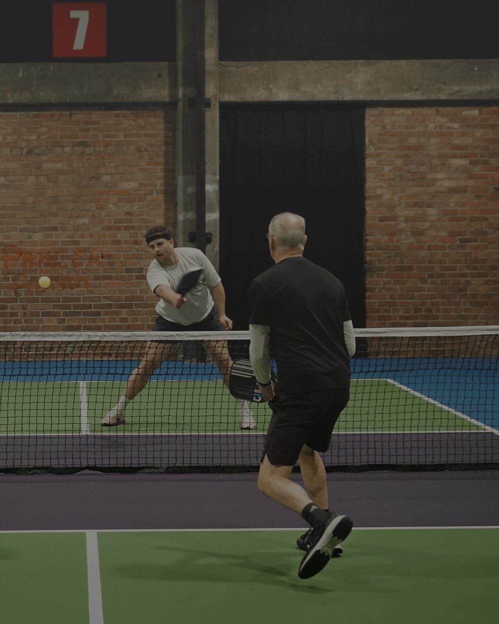 A work team playing pickleball together